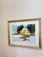 Framed watercolor painting on wall showing full view