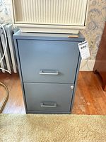 Front view of gray two-drawer filing cabinet