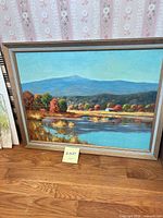 Front view of framed oil landscape painting