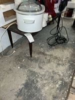 Full view of rectangular coffee table under small appliances