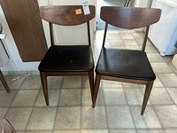 Front view of both chairs showing design and upholstery
