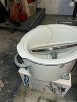 GE slow cooker atop Proctor-Silex toaster box