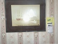 Front view showing ship image, mat and frame