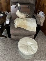 Group shot showing ottoman, blanket, Brookstone tray, fabric goose