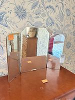 Front view of tri-fold mirror with side panels open