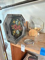 Group shot showing metal floral tray, mirror tray, wooden napkin holder, tumblers, and coaster