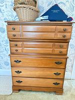 Front view of six-drawer dresser with hardware visible
