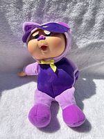 Front view of doll showing overall appearance and costume