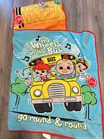 Full view of nap blanket showing front graphics and attached pillow