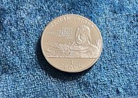 Reverse side of 1994 Isle of Man 1 Crown coin showing Louis Blériot and aircraft