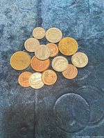 Group of mixed Irish coins laid out on fabric