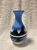 Front view of light blue hand-painted Navajo vase