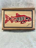 Top view showing entire lid artwork and signature