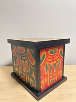 Front and side view of painted cedar bentwood box