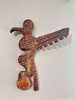 Front view of carved wooden eagle sculpture