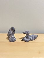 Loon and eagle figurines side by side