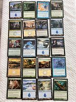 Full grid of 25 Magic cards displayed on cloth