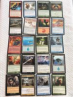 Twenty-one Magic: The Gathering cards arranged in four columns, showing variety of colors and types