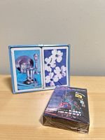 Sealed Riviera playing card deck alongside double-deck case
