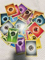 Pile of assorted Pokémon Energy cards showing various types