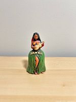 Front view of ceramic Hawaiian hula dancer bell