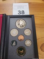 Open presentation case showing seven proof coins
