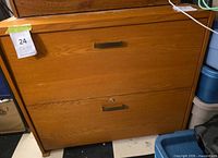 Front view showing two drawers, handles, lock