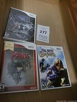 All three Wii game cases and lot tag visible