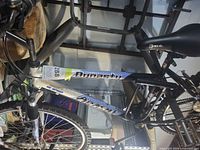 Full left side showing frame, wheels, fork, saddle