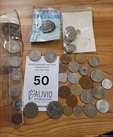 Overview of all coins including packaged Caribbean set and small bag