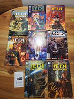 Eight Star Wars comic books laid out on table
