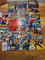 All ten Venom comic books laid out on tabletop