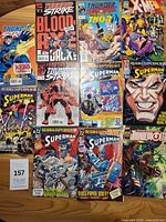 Group shot of eleven comics laid out on table