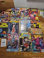 All twelve comic books laid out showing covers
