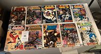 Overview of eleven bagged Punisher comics laid out on table