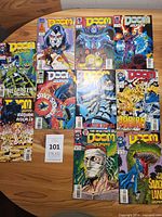 Eleven Doom 2099 comic books laid out on table