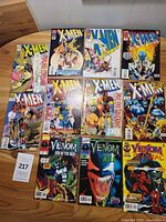 Group shot of all eleven comics laid out on table