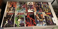 All twelve Ninjak comic books laid out in two rows