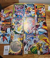 all twelve Silver Surfer comics laid out