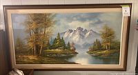 Front view of framed landscape painting showing entire artwork and frame