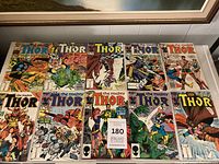 Tabletop view showing all ten The Mighty Thor comics