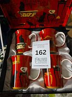 Four mugs in satin-lined presentation box