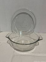 Casserole dish and pie plate shown together to display complete set