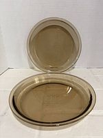 Two amber glass pie plates front view