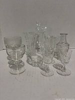 Group shot of all seven clear glass and crystal pieces