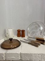 All items grouped: wooden shakers, antler knives, amber lid, mini jar, clear bowl, white vase