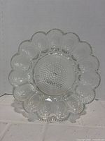 Front view of clear glass hobnail deviled egg plate