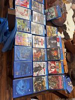 Tabletop view showing all 20 PS4 game cases
