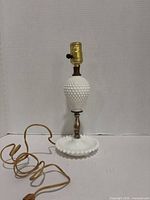 Full view of milk glass hobnail table lamp with cord