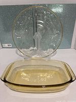 Amber glass baking dish front with clear egg platter standing behind